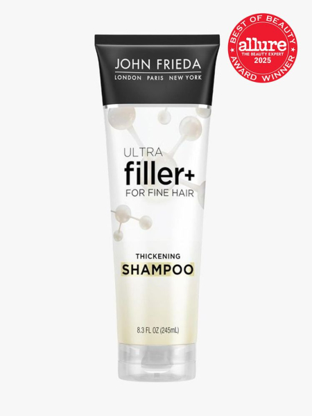 John Frieda ULTRAfiller+ Thickening Shampoo white tube of shampoo on light gray background