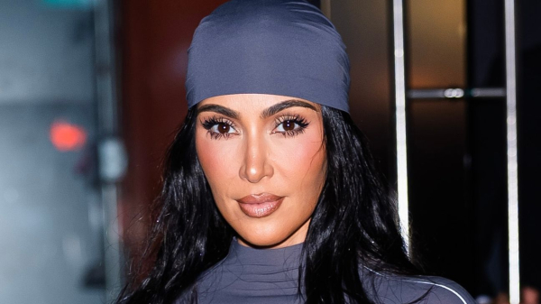 Kim Kardashian wearing a gray headscarf